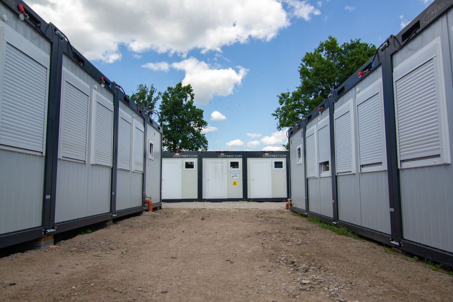 Rows of insulated site cabins on a compound